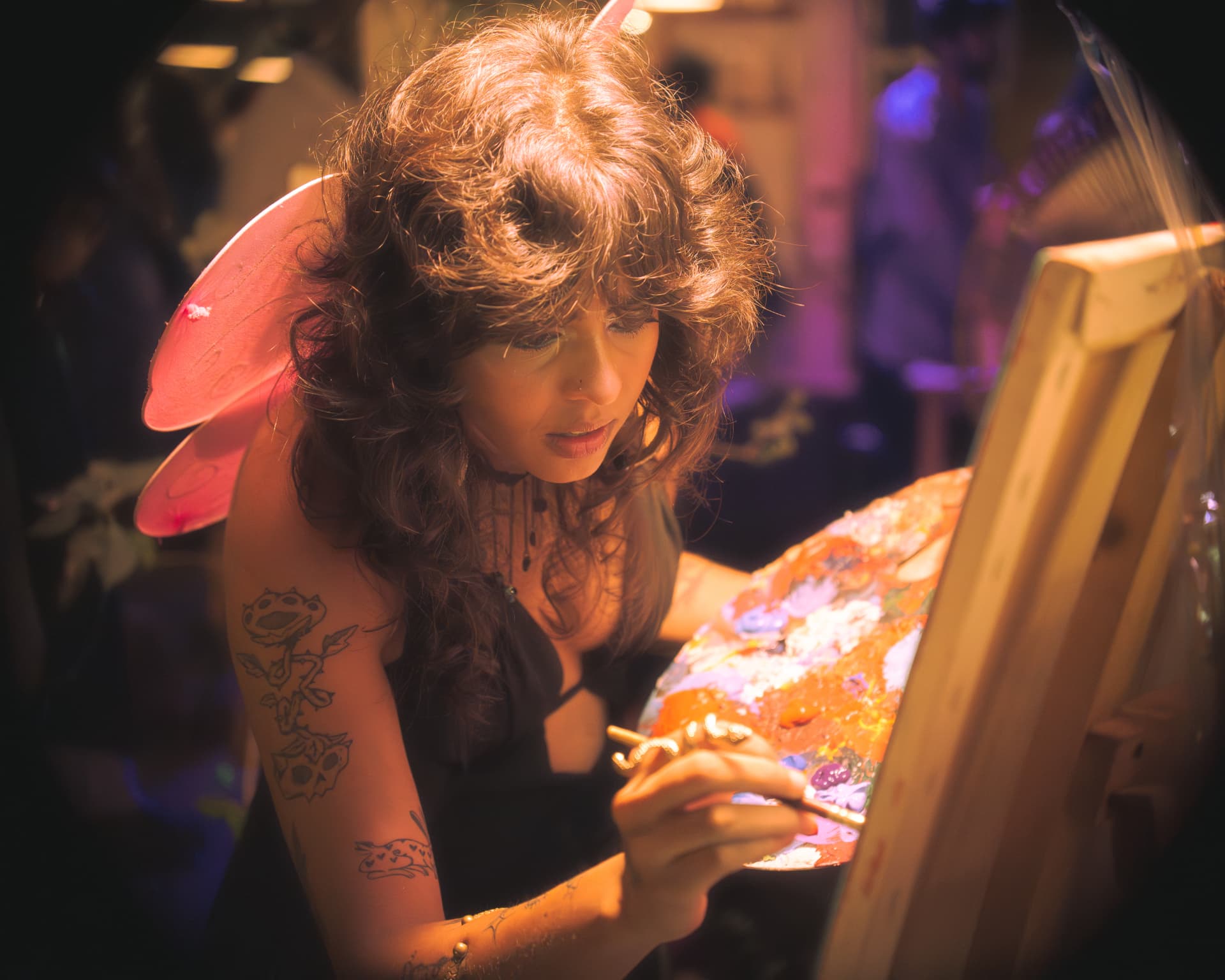 Artist focused on a canvas mid-performance